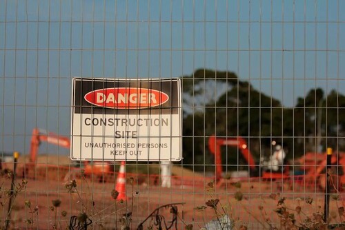 Temporary fencing securing a construction site
